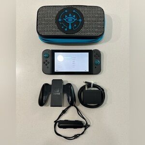 Nintendo Switch Console Model: HAC-001 with Accessories and Carrying Case.